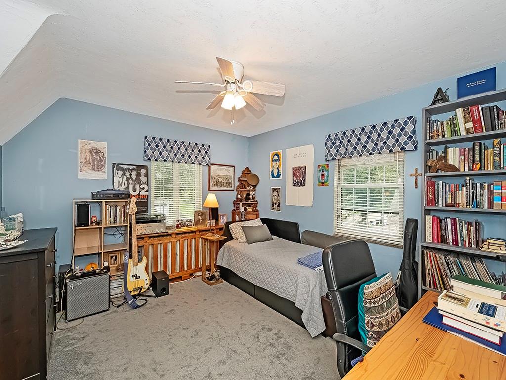644 Beverly Road Pittsburgh, PA 15243 - Photo 16 of 26 a bed room with a bed and a book shelf