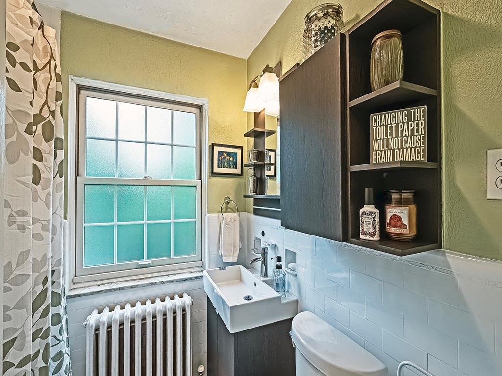 644 Beverly Road Pittsburgh, PA 15243 - Photo 18 of 26 a bathroom with a toilet a sink and a window