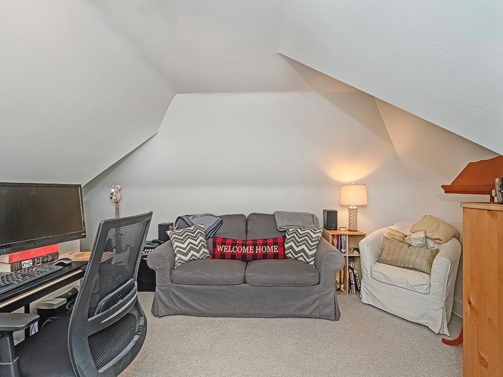 644 Beverly Road Pittsburgh, PA 15243 - Photo 20 of 26 a living room with furniture and a flat screen tv