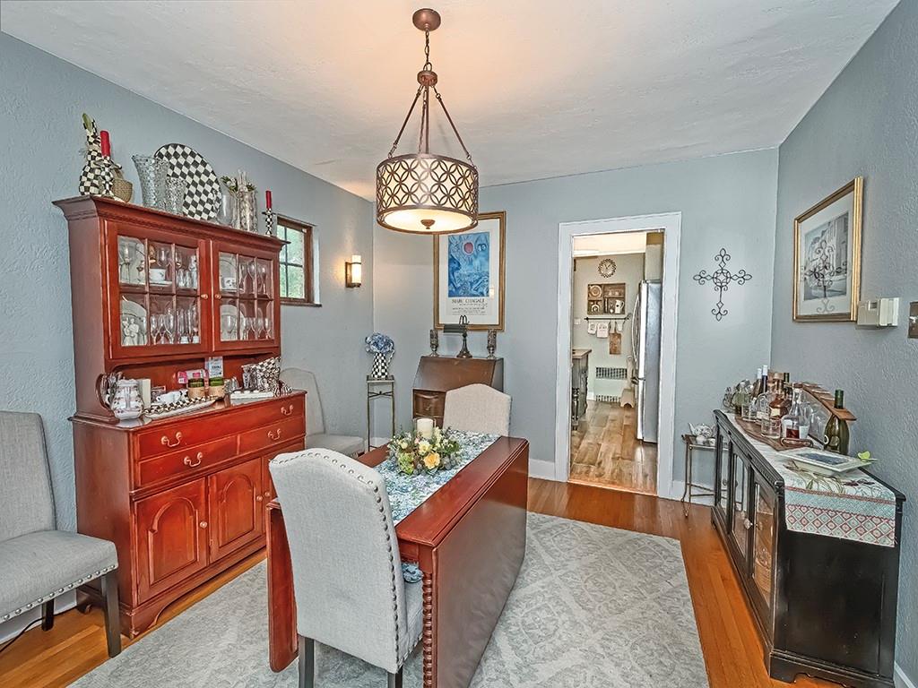 644 Beverly Road Pittsburgh, PA 15243 - Photo 7 of 26 a dining room with furniture a chandelier and wooden floor