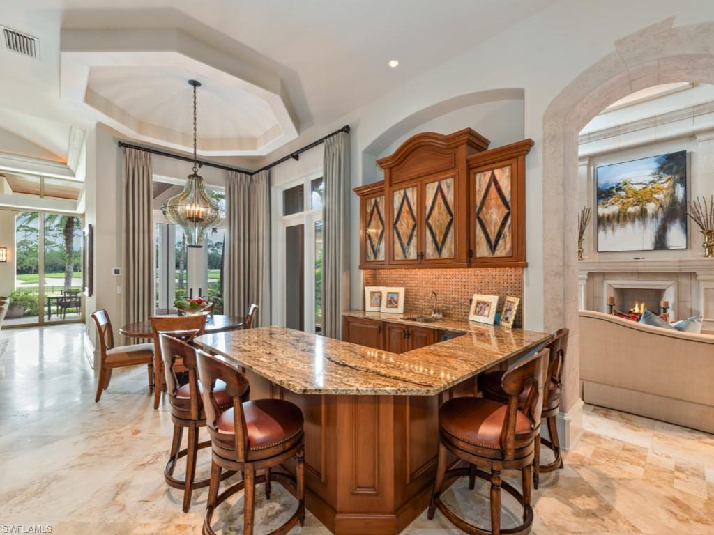 17012 Treviso Way Naples, FL 34110 - Photo 10 of 50 a view of a dining room with furniture window and outside view