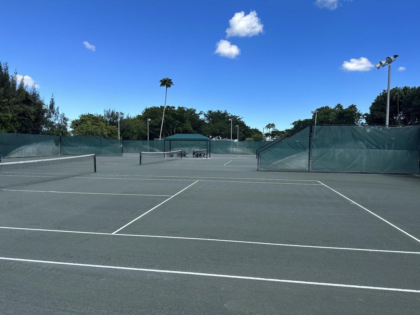 7281 Amberly Lane, Unit 308 Delray Beach, FL 33446 - Photo 18 of 20 a view of a tennis court