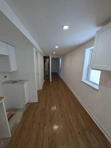 a view of a livingroom with wooden floor
