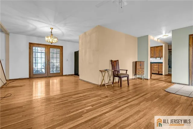 a view of empty room with furniture and a window