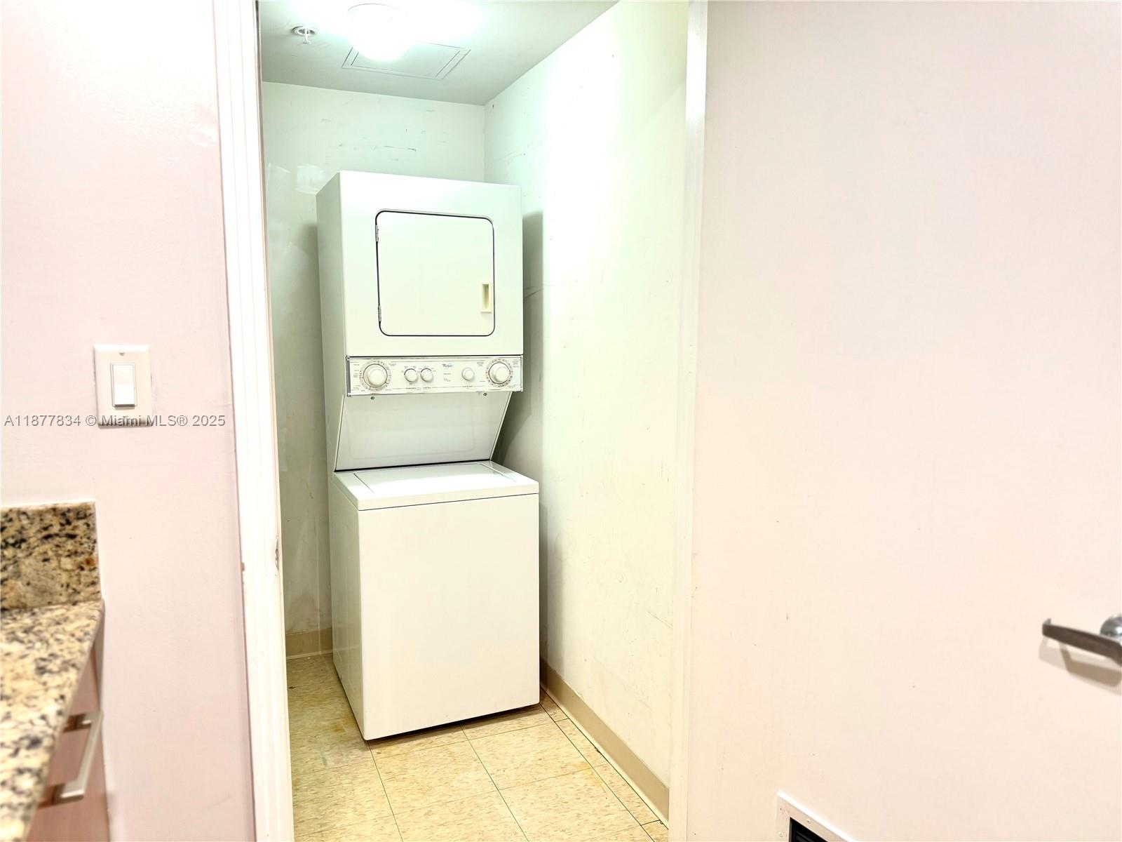 9055 Southwest 73rd Court, Unit 1705 Miami, FL 33156 - Photo 15 of 16 a utility room with dryer and washer