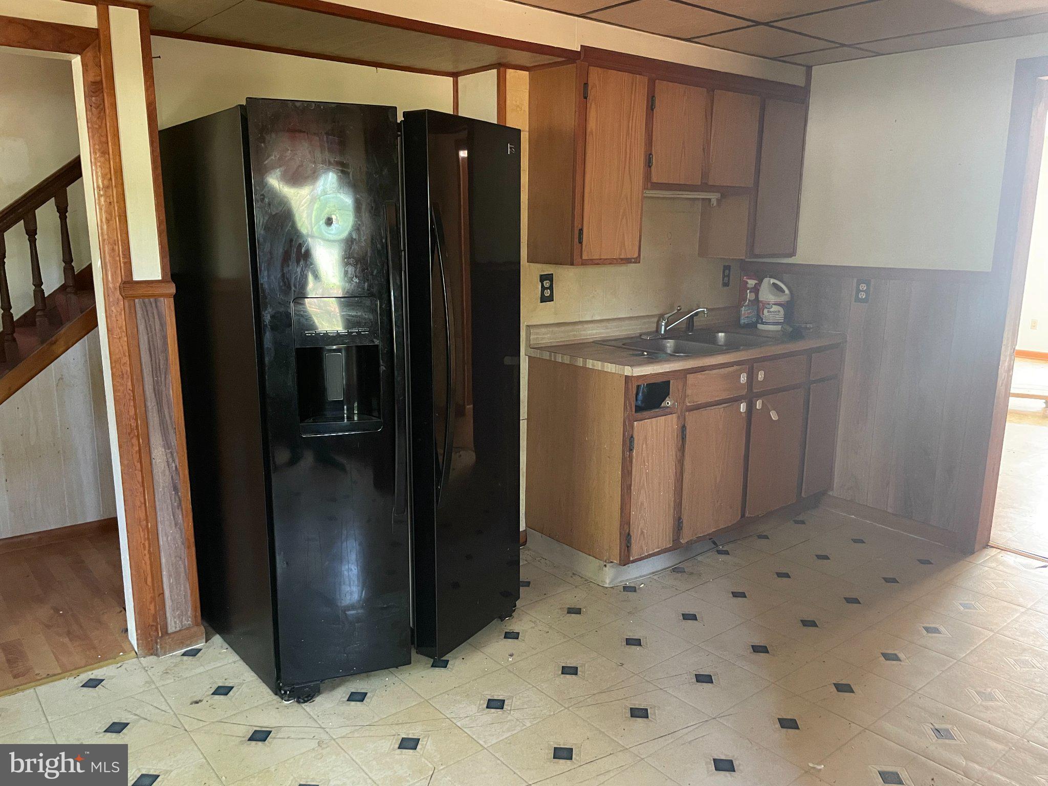 1113 Taylors Island Road Madison, MD 21648 - Photo 19 of 35 a kitchen with stainless steel appliances granite countertop a refrigerator and a counter