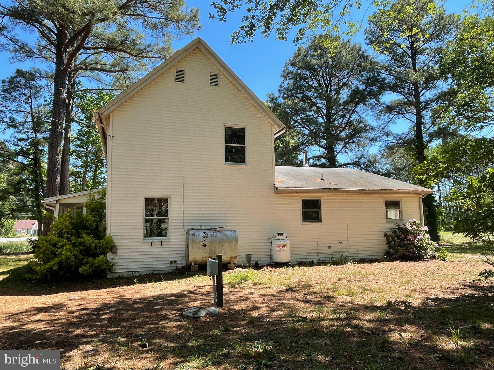 1113 Taylors Island Road Madison, MD 21648 - Photo 2 of 35 a front view of a house with a yard