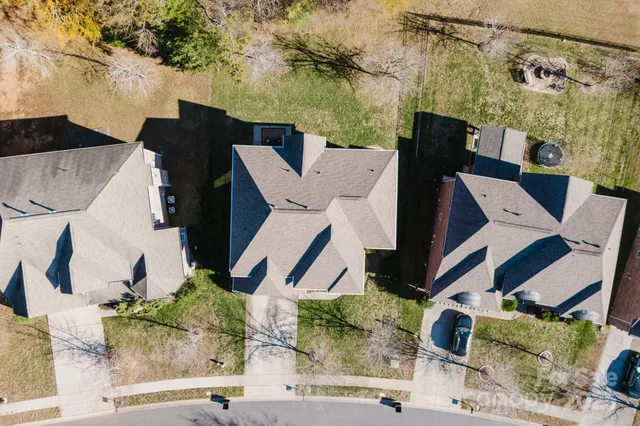 an aerial view of a yard with table and chairs