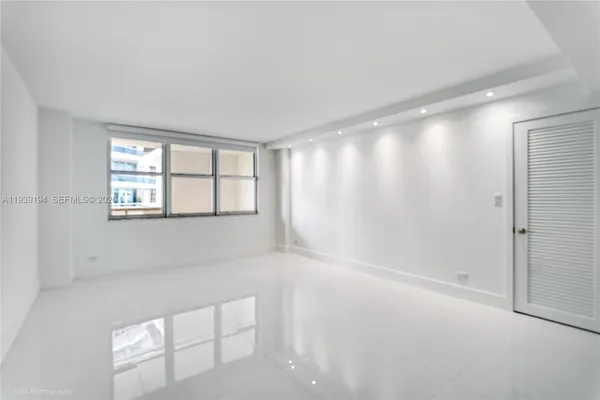 a view of an empty room with a window