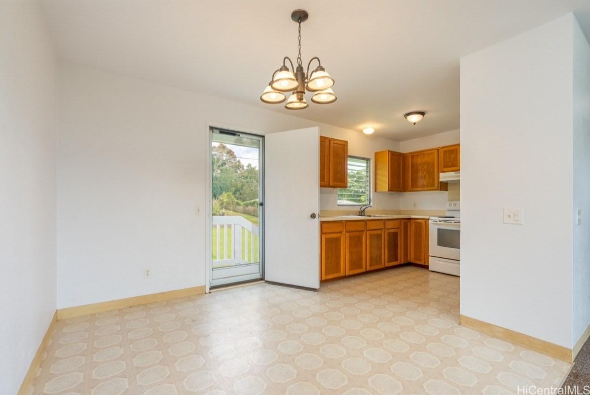 6363 A Puupilo Road Kapaa, HI 96746 - Photo 5 of 19 a large kitchen with a window and stainless steel appliances