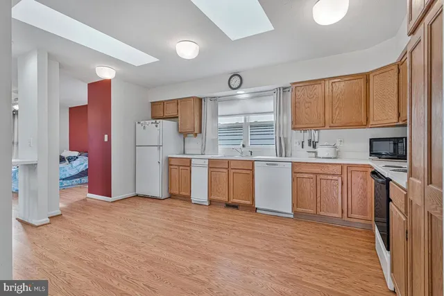 a view of a house with wooden deck
