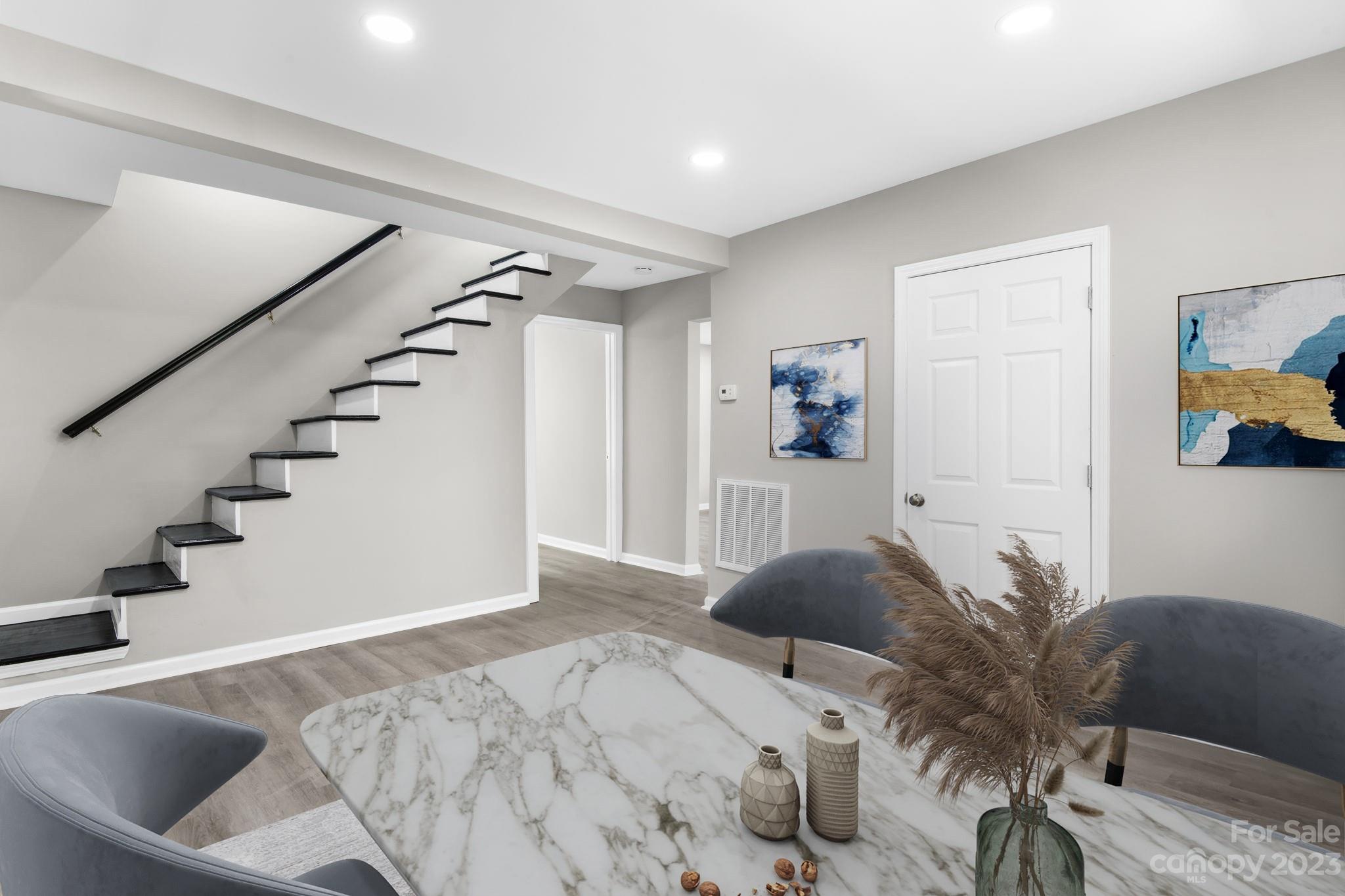 60 Hunter Bridge Road Stony Point, NC 28678 - Photo 12 of 43 a view of a livingroom with furniture and staircase