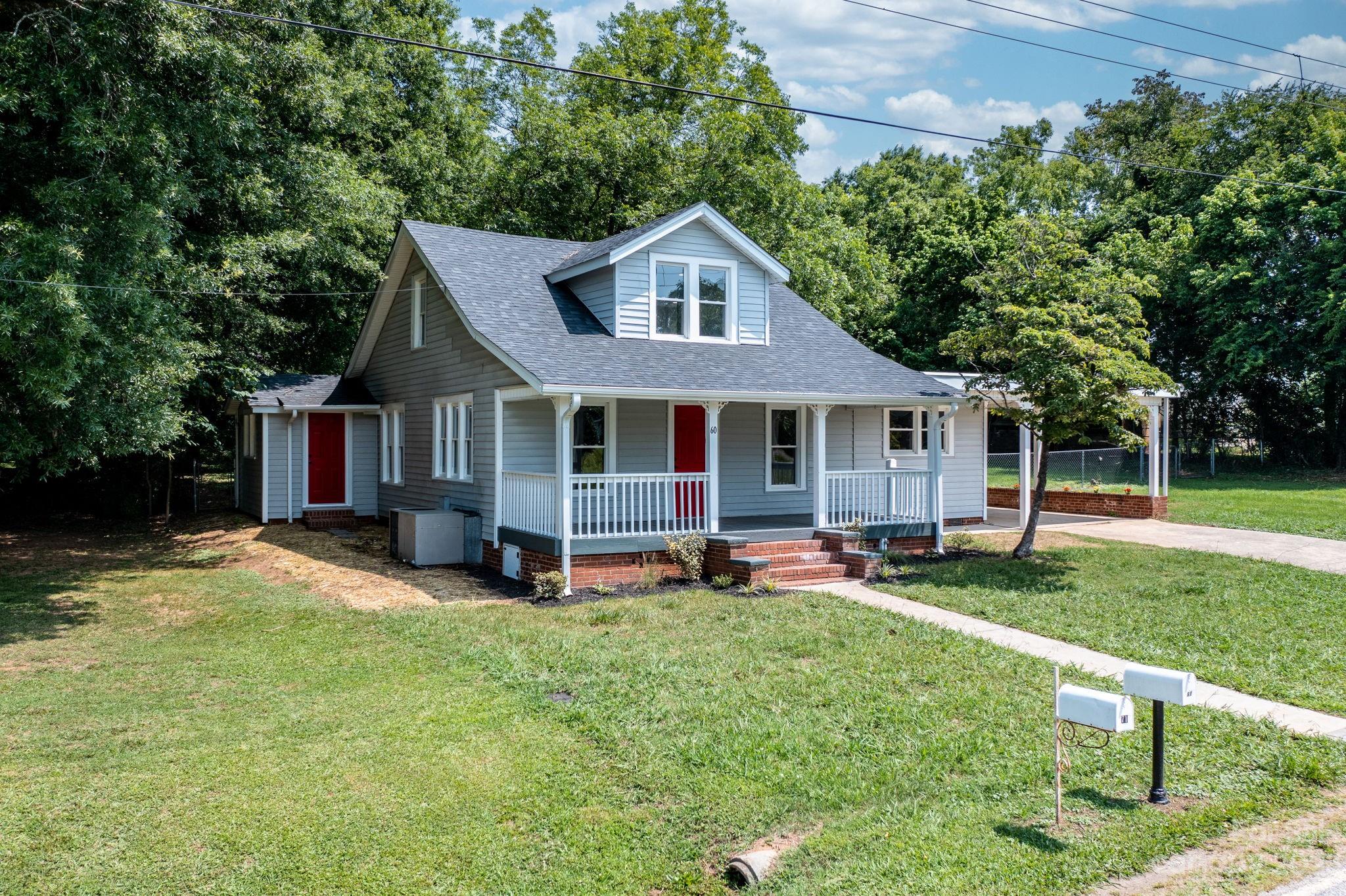 60 Hunter Bridge Road Stony Point, NC 28678 - Photo 3 of 43 a front view of a house with a yard and trees