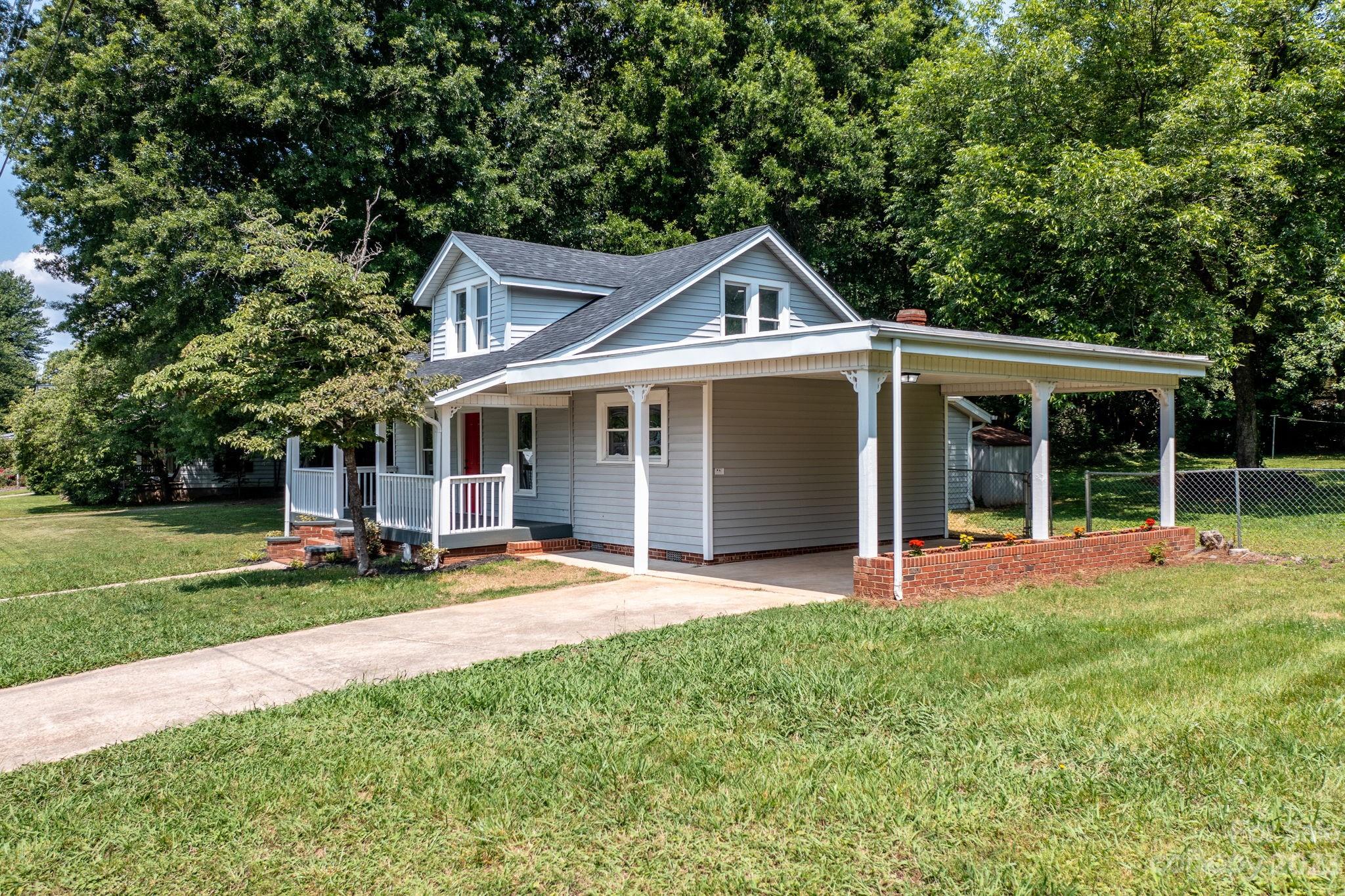 60 Hunter Bridge Road Stony Point, NC 28678 - Photo 33 of 43 a front view of a house with a yard and trees