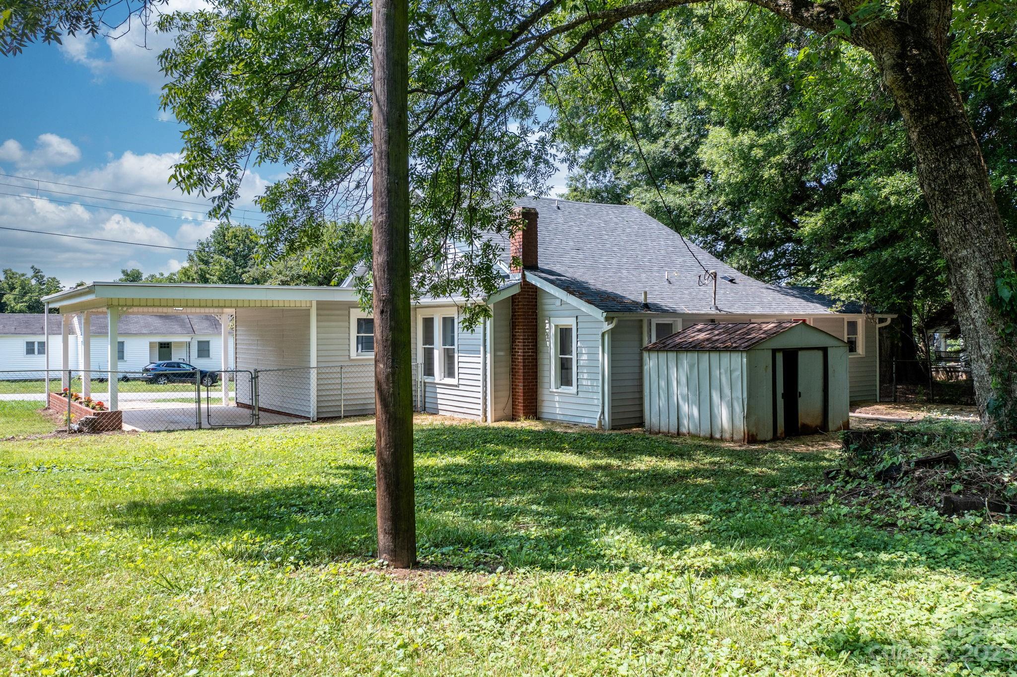 60 Hunter Bridge Road Stony Point, NC 28678 - Photo 36 of 43 a view of a house with a yard and sitting area