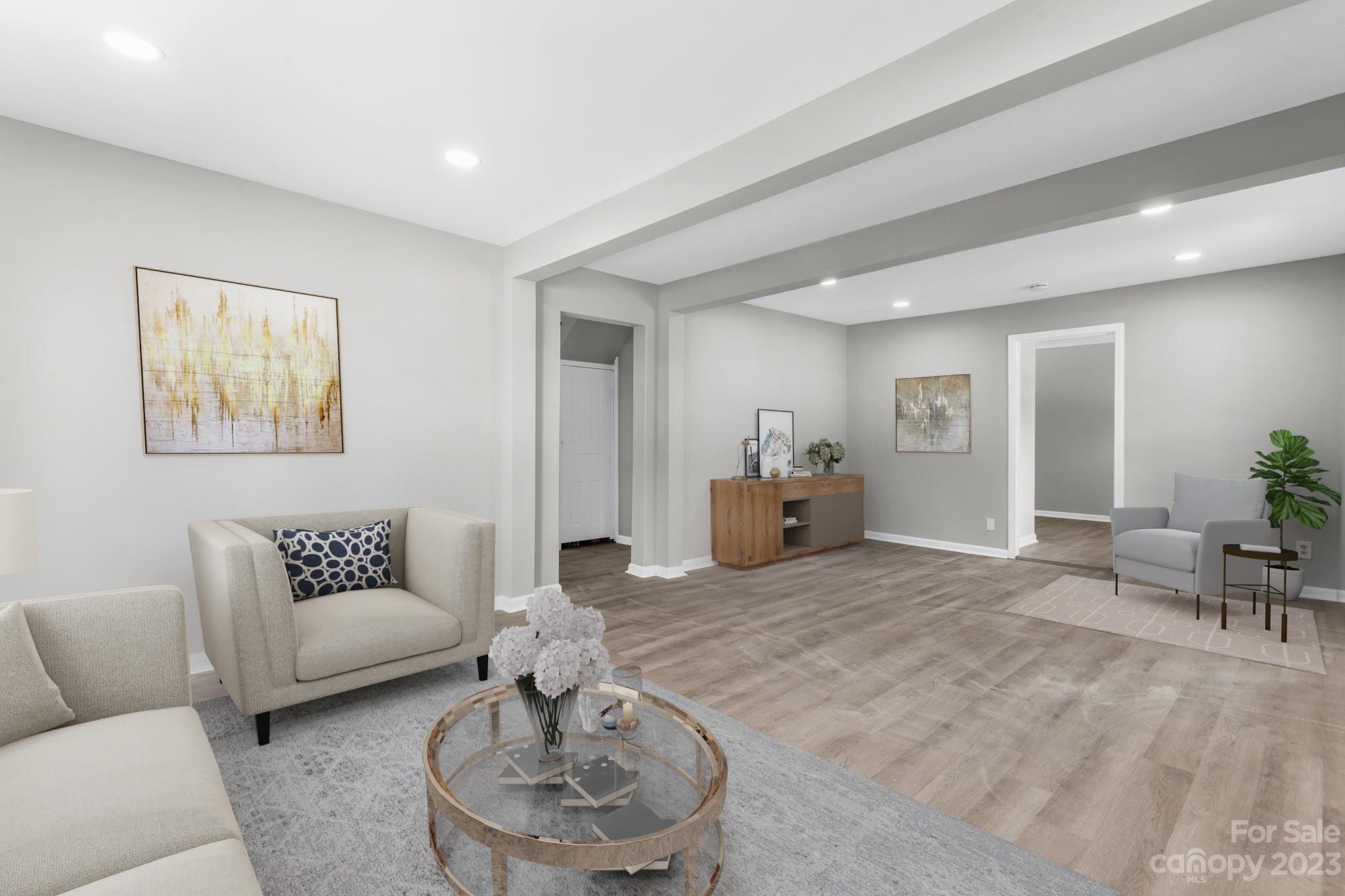 60 Hunter Bridge Road Stony Point, NC 28678 - Photo 4 of 43 a living room with furniture and a dining table with rug
