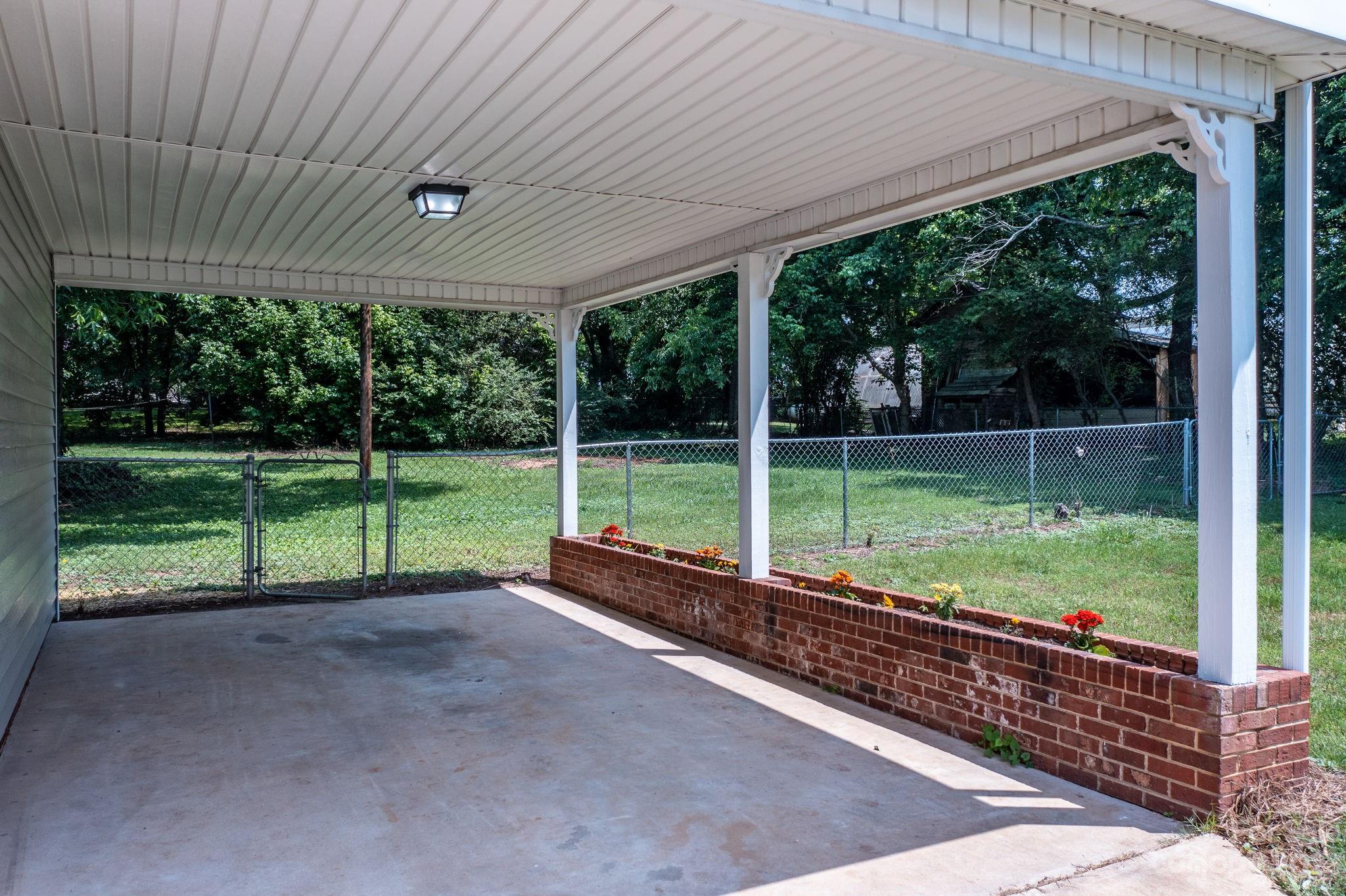 60 Hunter Bridge Road Stony Point, NC 28678 - Photo 43 of 43 a view of a backyard with grass and floor to ceiling window