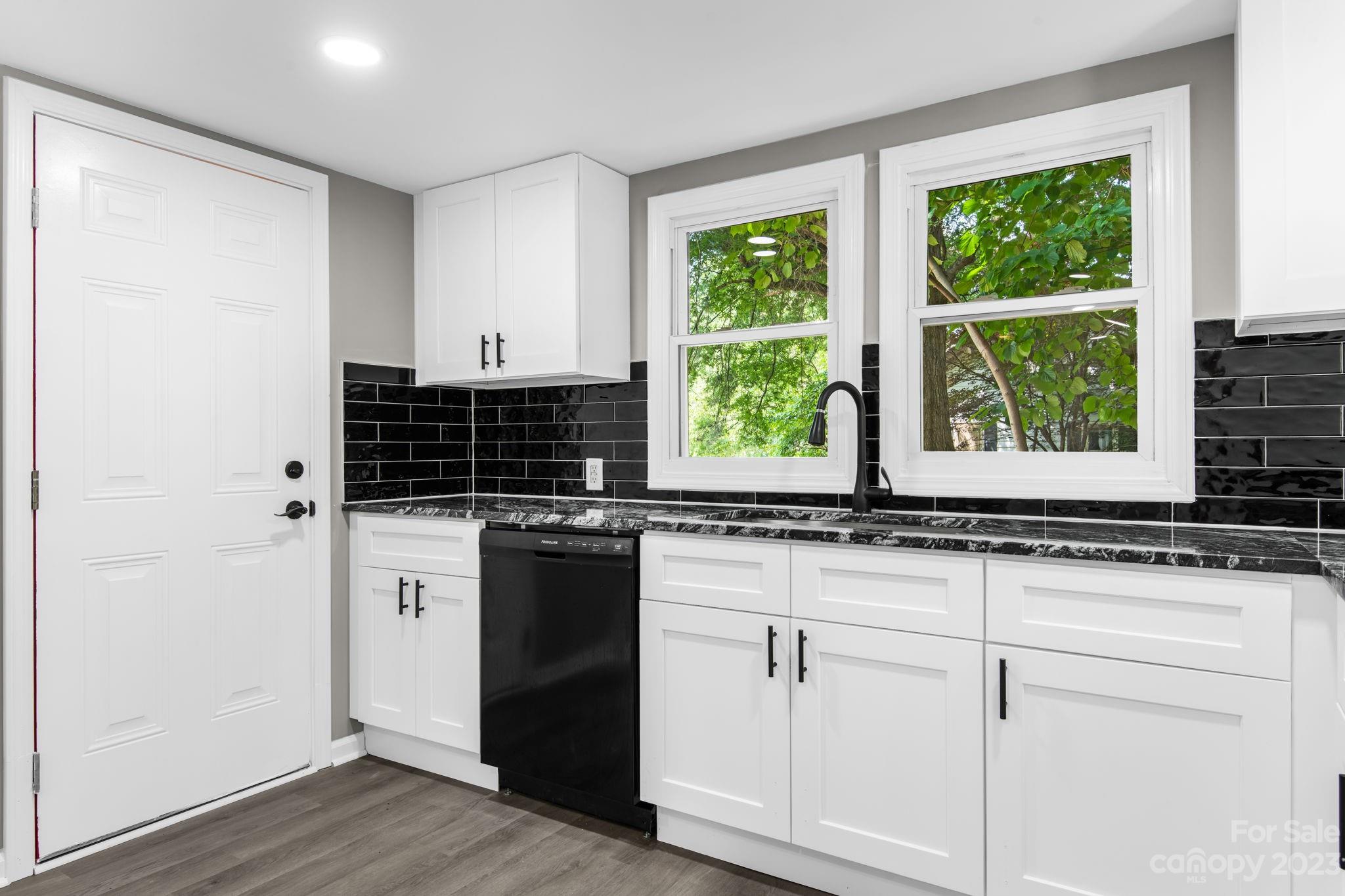 60 Hunter Bridge Road Stony Point, NC 28678 - Photo 8 of 43 a kitchen with stainless steel appliances granite countertop a sink and a window