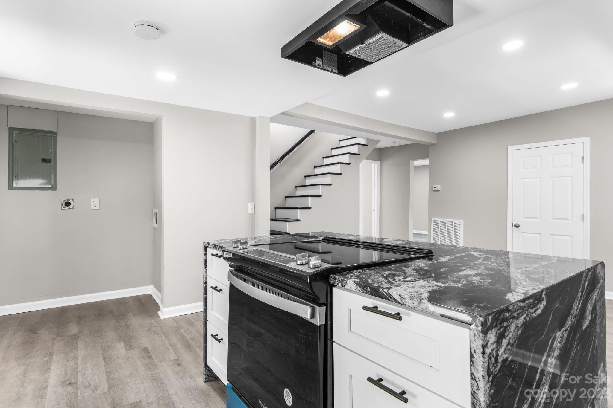 60 Hunter Bridge Road Stony Point, NC 28678 - Photo 9 of 43 a kitchen that has a sink a stove and wooden floor