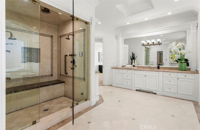 a spacious bedroom with a large bed and a large window