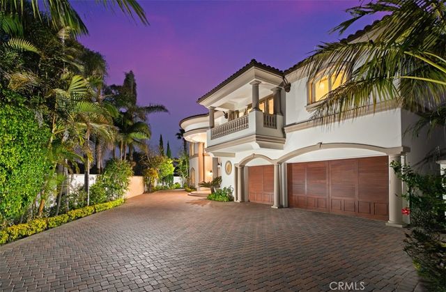 a kitchen with stainless steel appliances kitchen island granite countertop a refrigerator and a stove top oven