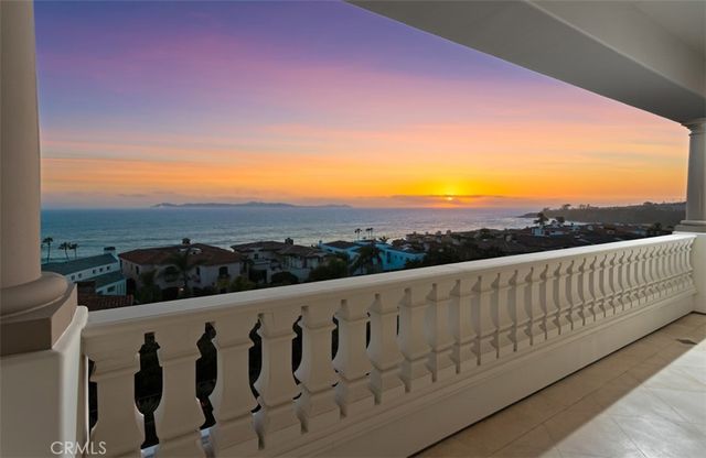 a view of a kitchen and dining area with a large window