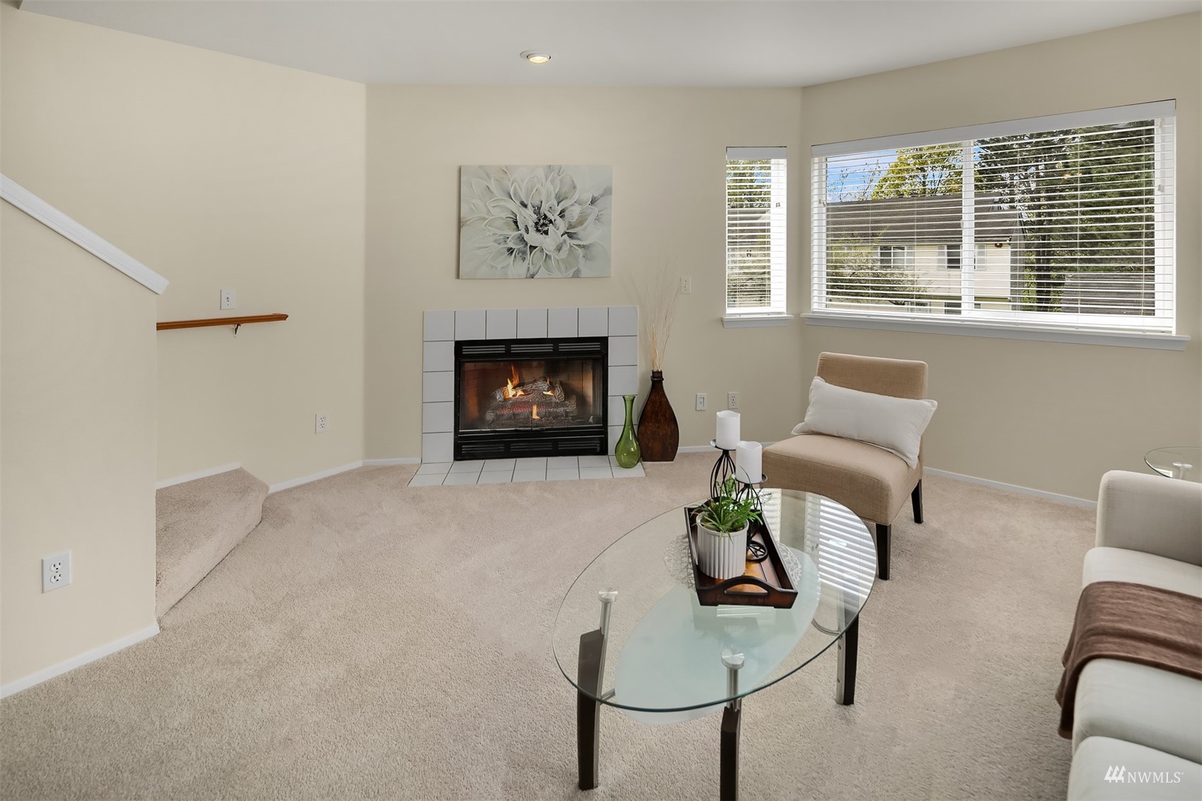 833 Southwest Sunset Boulevard, Unit G37 Renton, WA 98057 - Photo 12 of 21 a living room with furniture and a fireplace