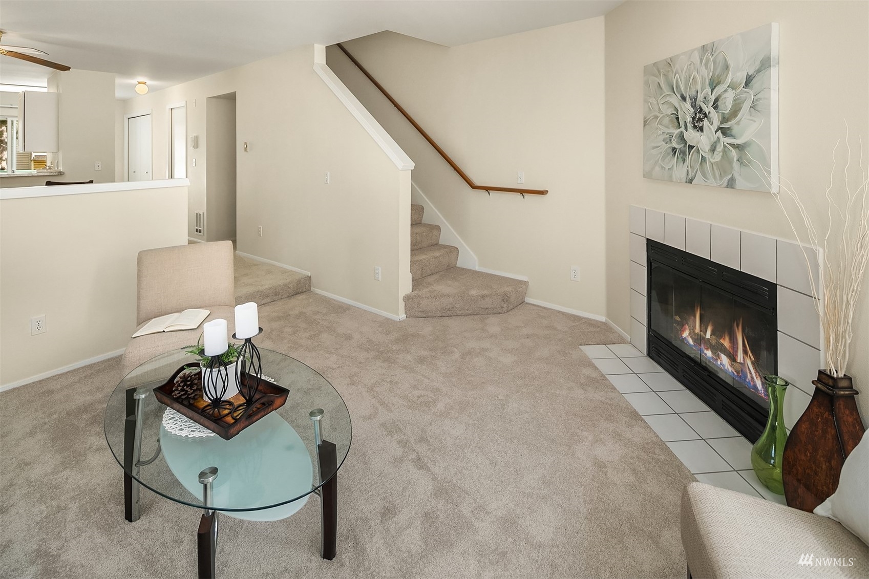 833 Southwest Sunset Boulevard, Unit G37 Renton, WA 98057 - Photo 13 of 21 a living room with furniture and a fireplace