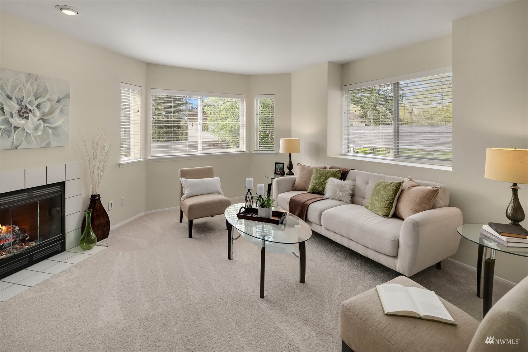 833 Southwest Sunset Boulevard, Unit G37 Renton, WA 98057 - Photo 9 of 21 a living room with furniture and a fireplace