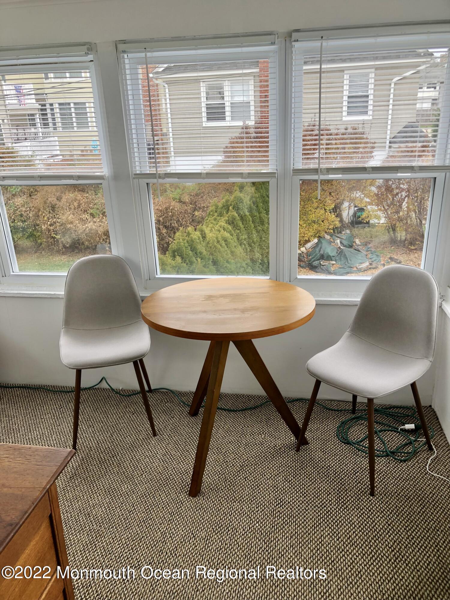 106 Lincoln Lane, Unit WINTER RENTAL Avon-by-the-Sea, NJ 07717 - Photo 8 of 11 a workspace with furniture and a window