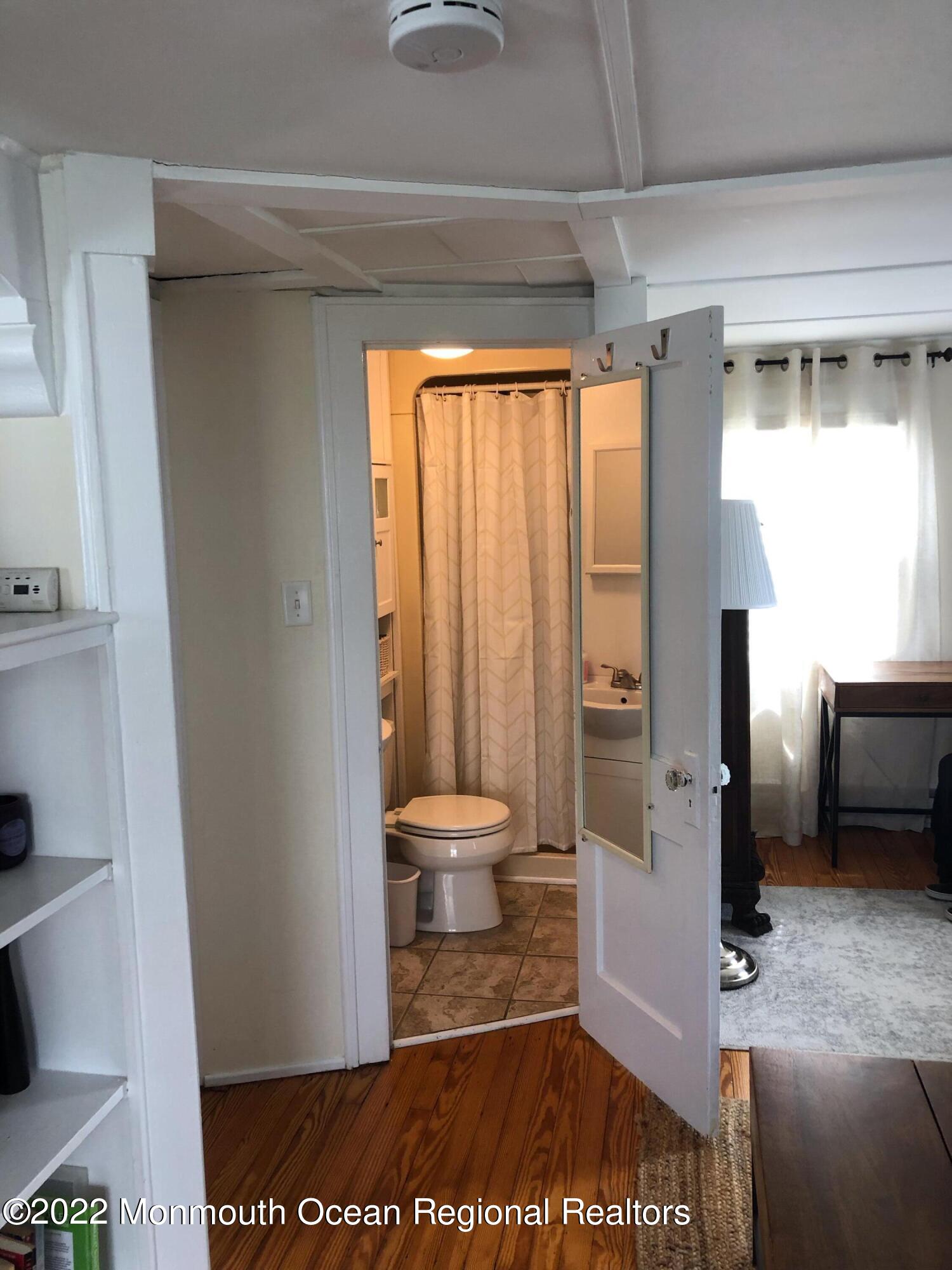 106 Lincoln Lane, Unit WINTER RENTAL Avon-by-the-Sea, NJ 07717 - Photo 10 of 11 a bathroom with a toilet and a shower