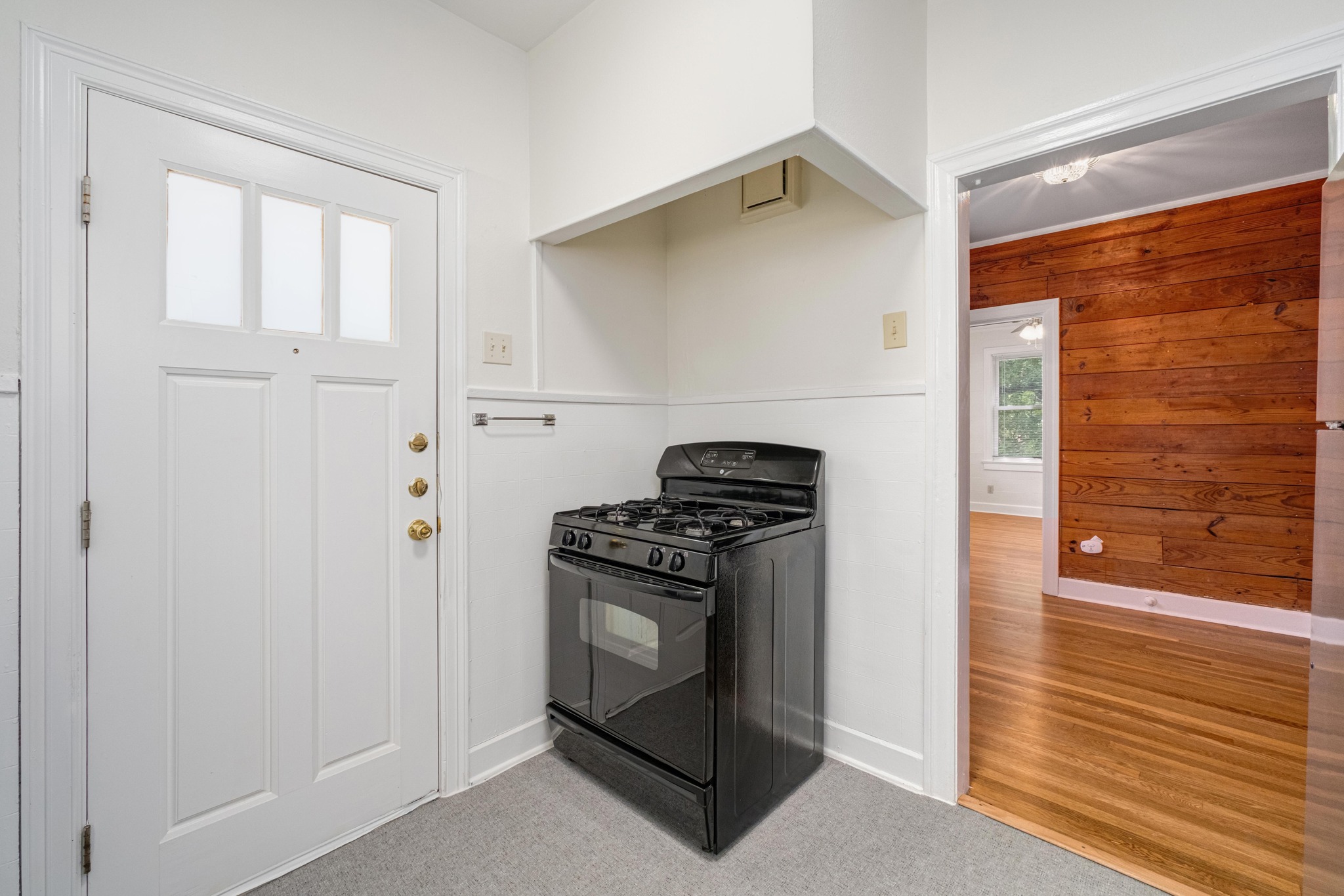 2012 Enfield Road, Unit B Austin, TX 78703 - Photo 8 of 20 A well-appointed kitchen corner features a gas range and direct access to an adjacent room.