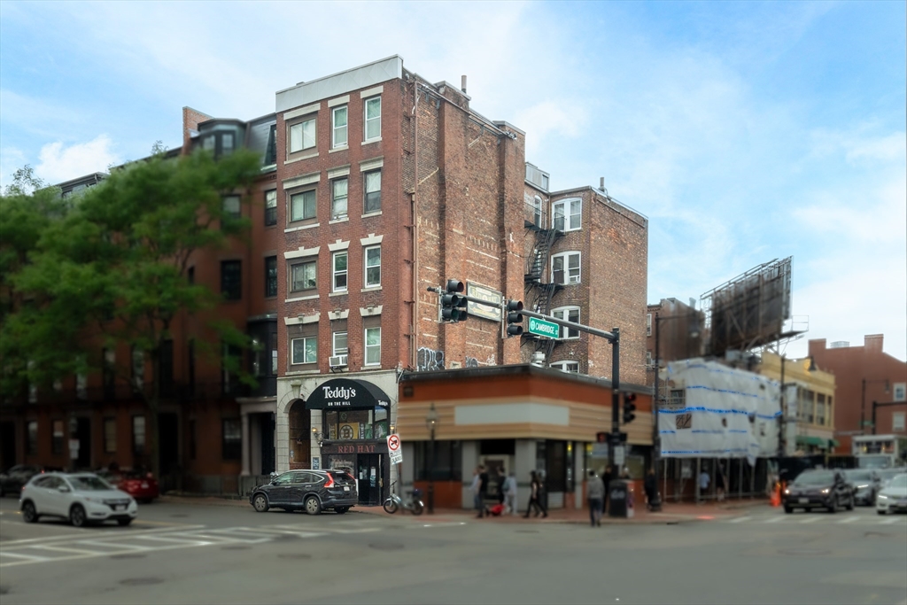 9 Bowdoin Street Boston, MA 02114 - Photo 1 of 1 a front view of a building with lot of cars and trees
