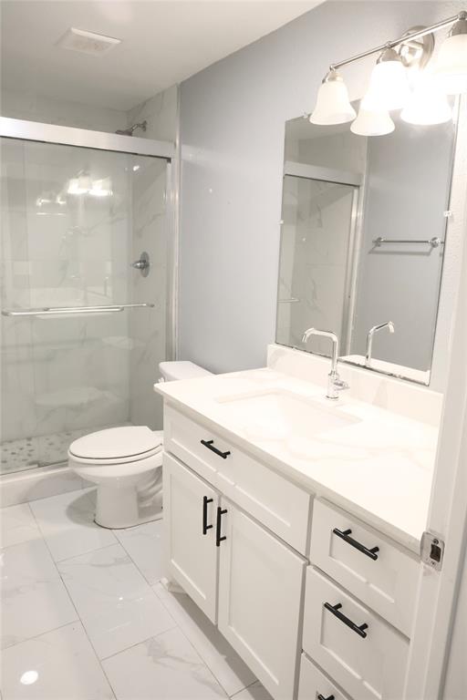 494 Lannius Road Dodd City, TX 75438 - Photo 18 of 40 a bathroom with a sink a toilet and shower