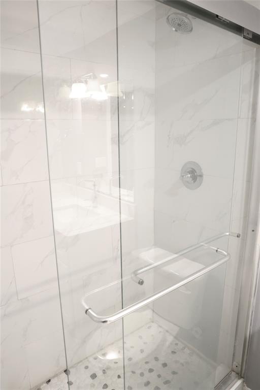 494 Lannius Road Dodd City, TX 75438 - Photo 19 of 40 a bathroom with a glass shower door