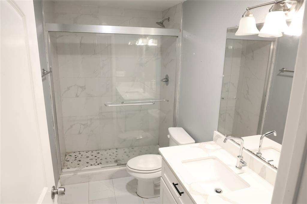 494 Lannius Road Dodd City, TX 75438 - Photo 20 of 40 a bathroom with a sink toilet and shower