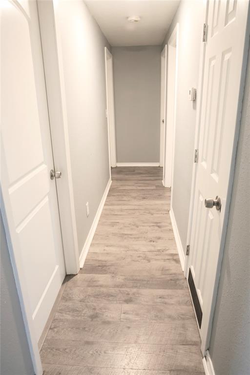 494 Lannius Road Dodd City, TX 75438 - Photo 32 of 40 a view of a hallway with wooden floor and staircase