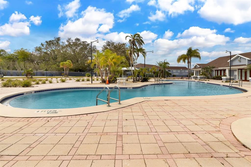 221 Caribbean Drive Davenport, FL 33897 - Photo 12 of 15 a view of a swimming pool with lounge chairs