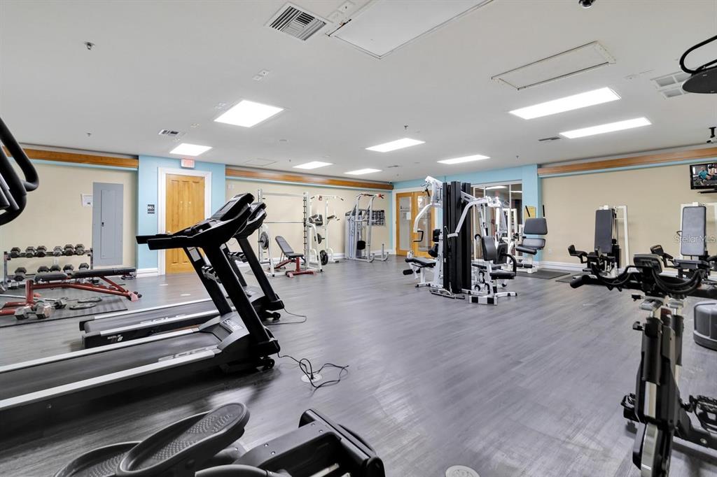 221 Caribbean Drive Davenport, FL 33897 - Photo 13 of 15 a view of a room with gym equipment