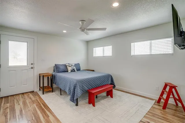 a view of a livingroom with furniture and floor to ceiling window