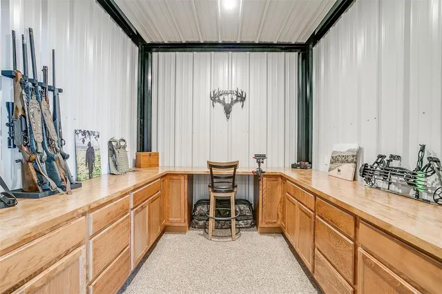 a spacious bedroom with a bed and a chandelier