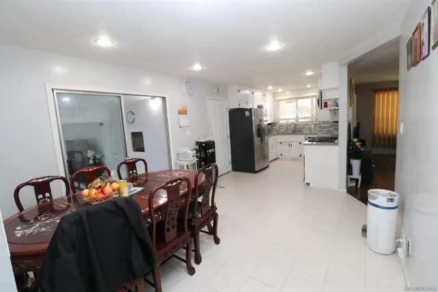 a kitchen with a refrigerator and a sink