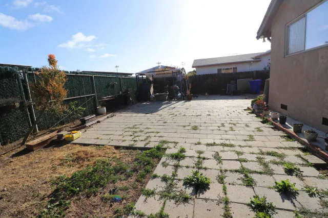 a backyard of a house with outdoor seating