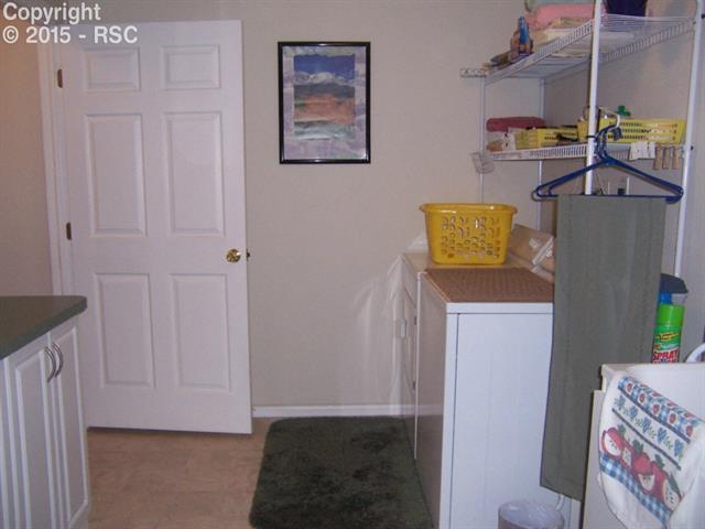 12456 Snaffle Bit Road Peyton, CO 80831 - Photo 6 of 14 Laundry Room #1 Main Level. Plenty of room to fold! Sink in corner.