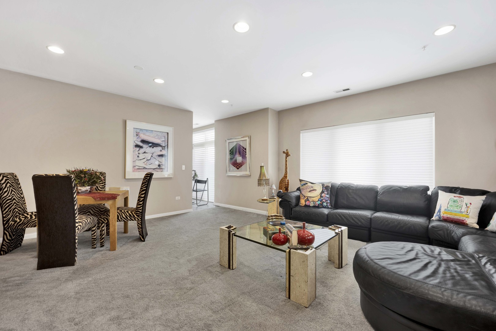 800 Weidner Road, Unit 208 Buffalo Grove, IL 60089 - Photo 4 of 19 a living room with furniture and a large window