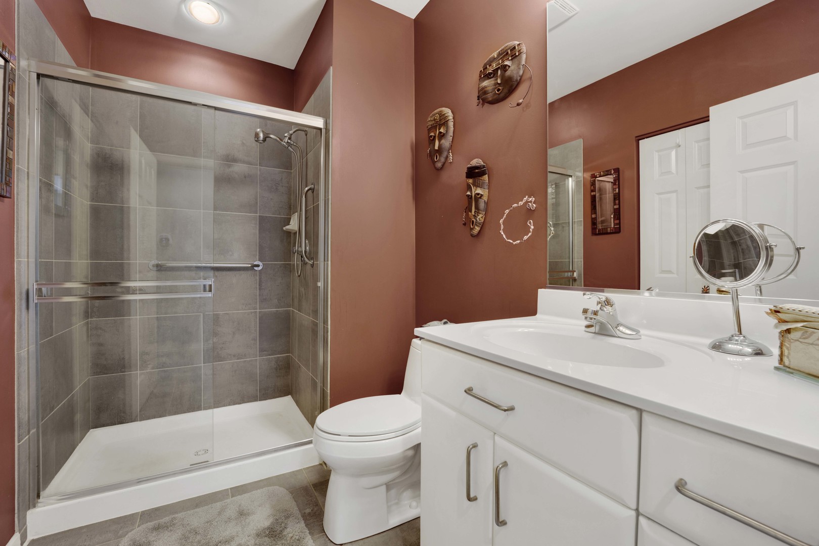 800 Weidner Road, Unit 208 Buffalo Grove, IL 60089 - Photo 10 of 19 a bathroom with a sink toilet and shower