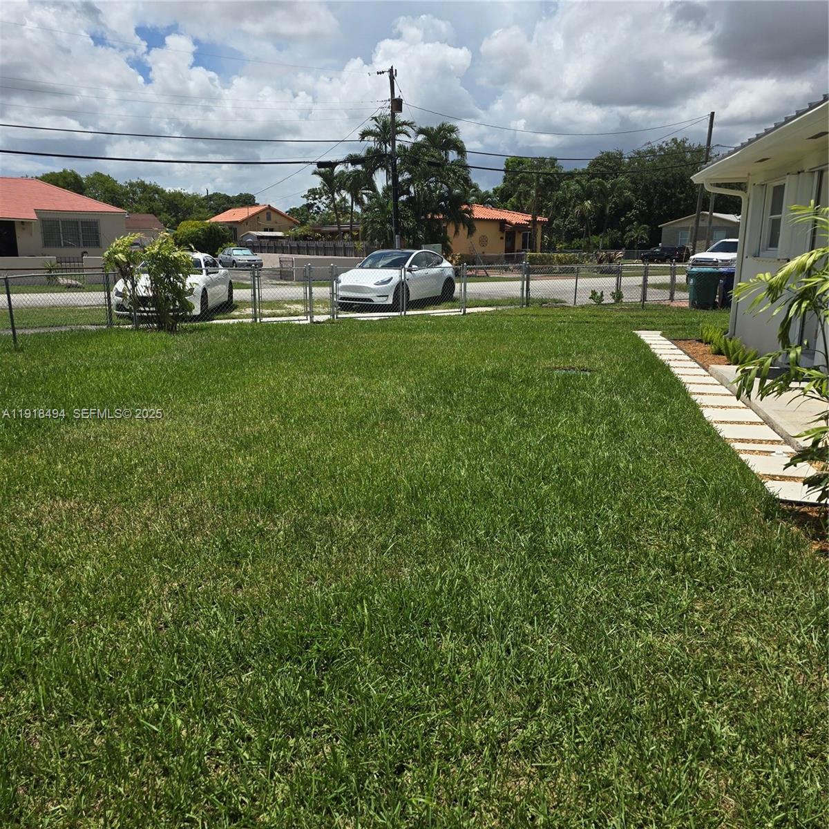 122 Northwest Boulevard, Unit B Miami, FL 33126 - Photo 16 of 17 a view of a yard in front of the house