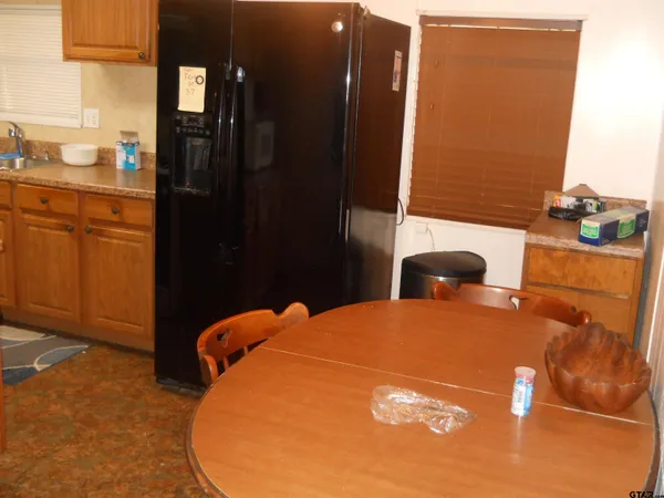 a bedroom with a bed mirror and a window