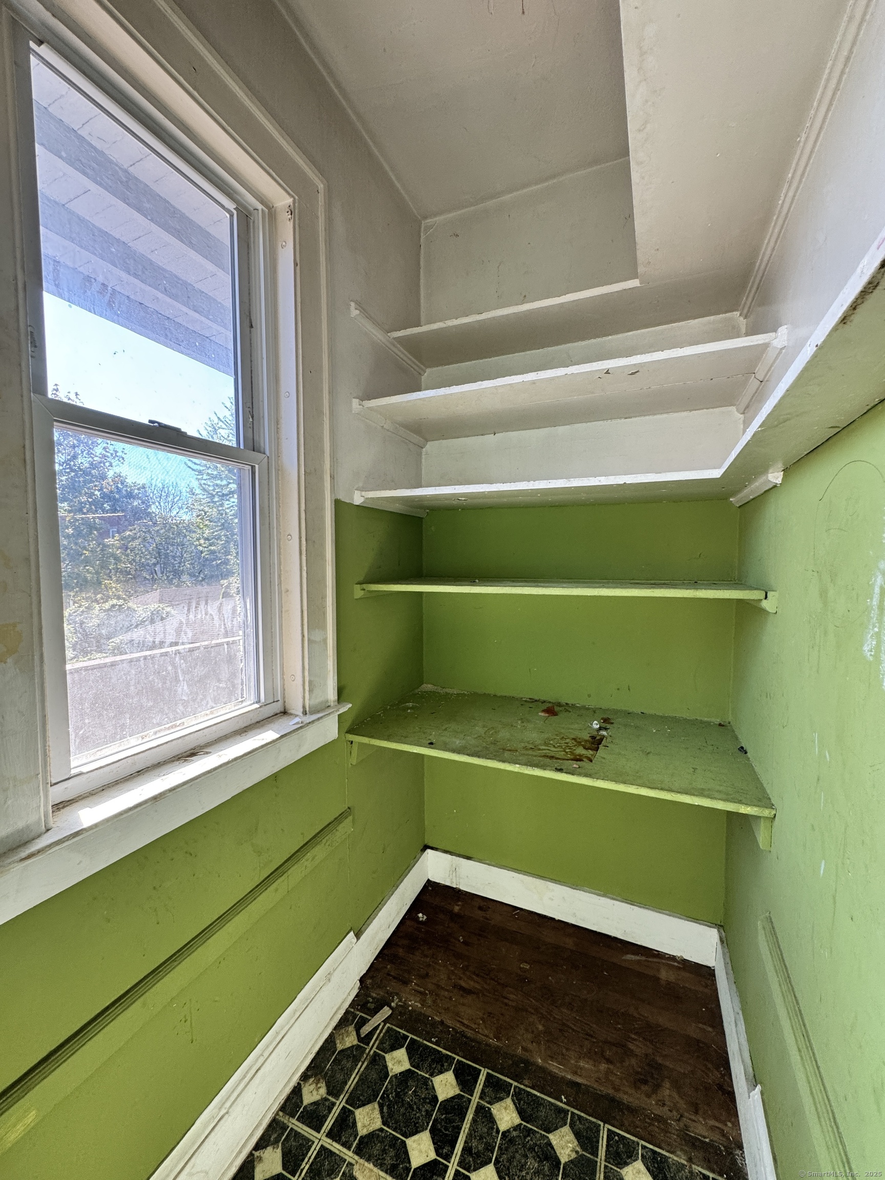 102 Rowe Avenue Hartford, CT 06106 - Photo 14 of 28 a room with a fan and a window