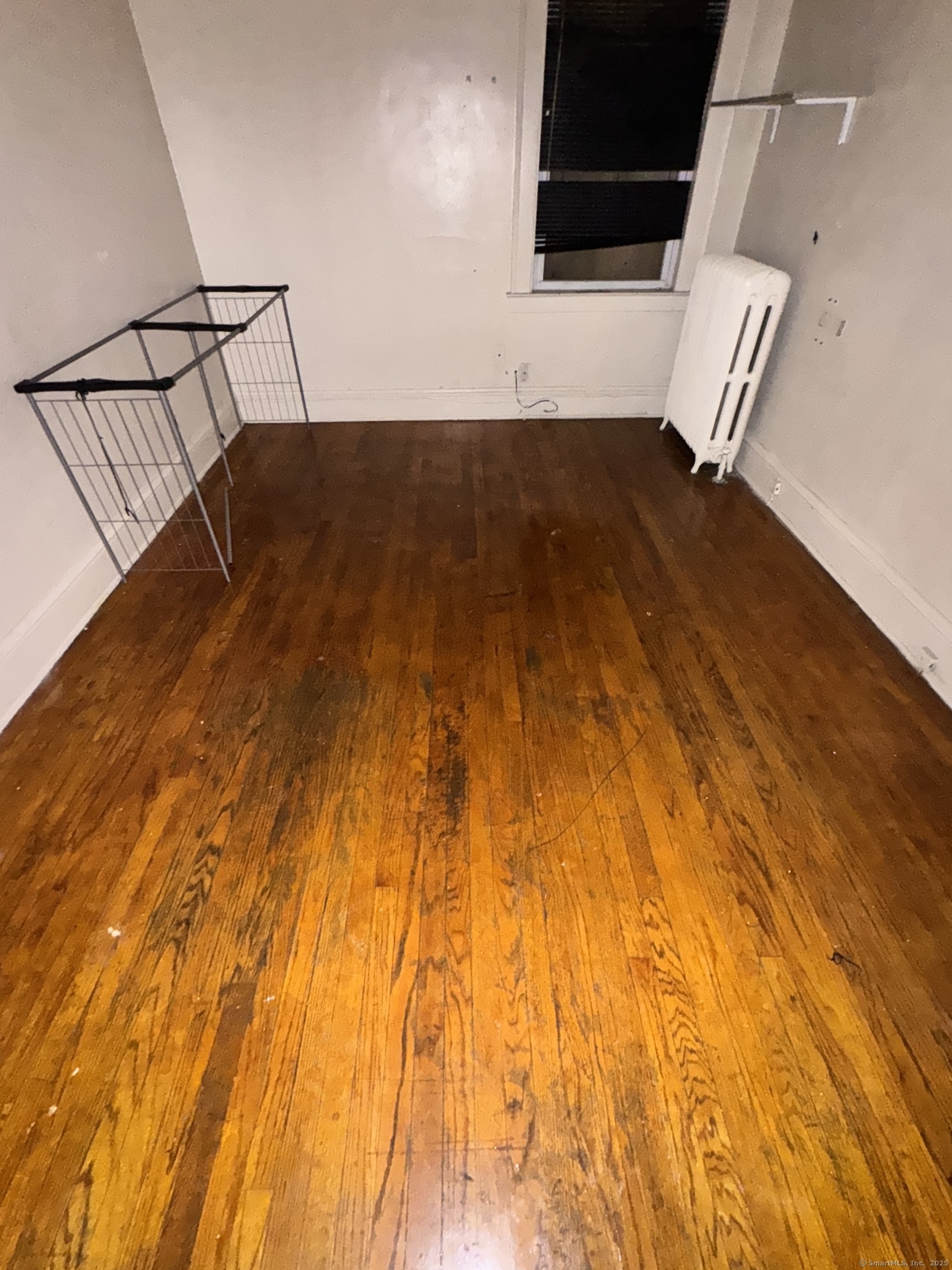 102 Rowe Avenue Hartford, CT 06106 - Photo 22 of 28 a view of an empty room with wooden floor